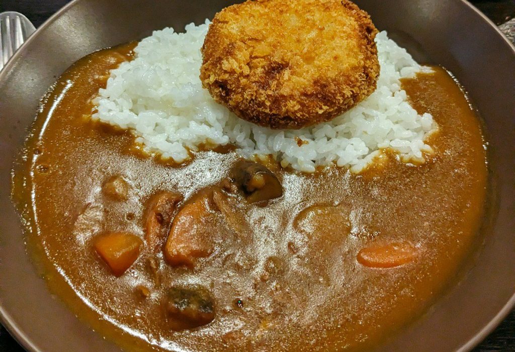 a plate of food with rice and meat